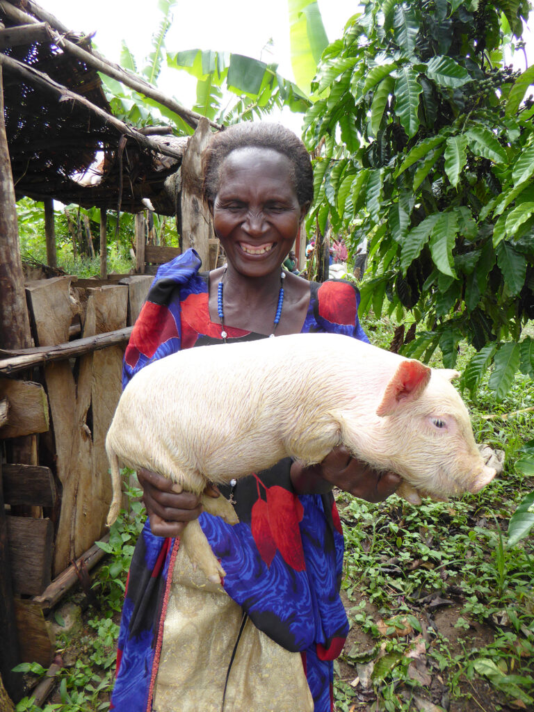 Woman holding pig